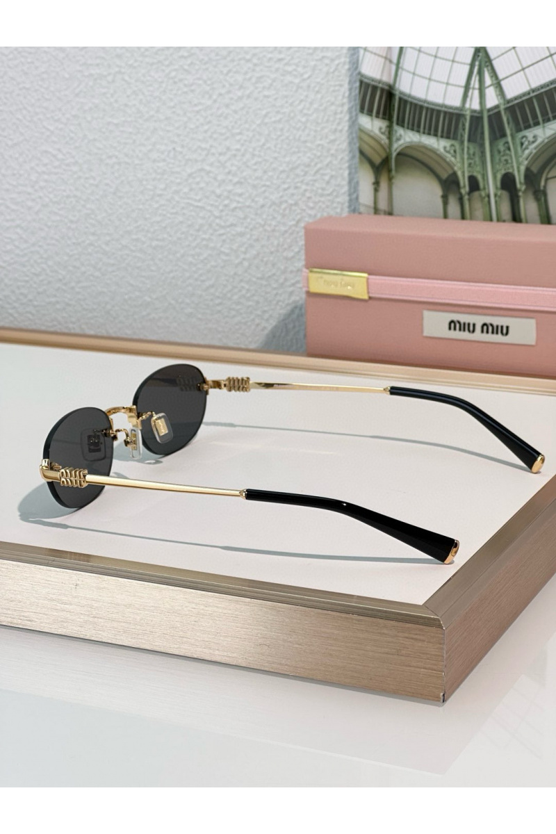 MIU MIU Женские солнцезащитные очки с чёрными линзами