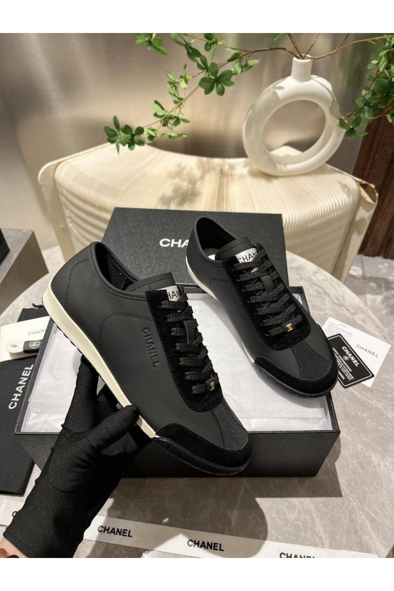 Chаnеl Женские кожаные кроссовки чёрного цвета