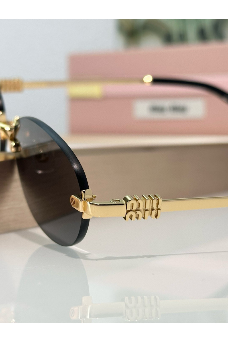 MIU MIU Женские солнцезащитные очки с чёрными линзами